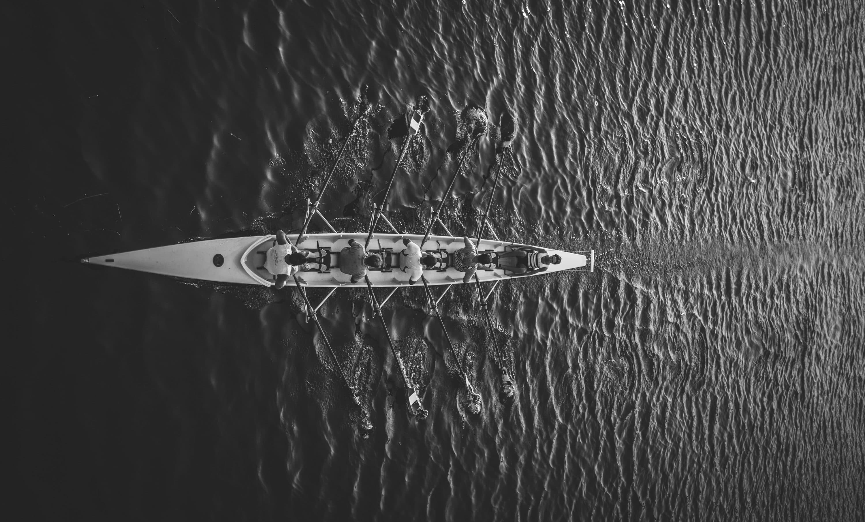 A rowing eight pulling in unison, seen from above